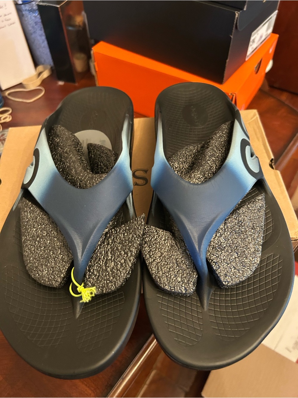 Men’s OOfos Blue and Black Flip Flops